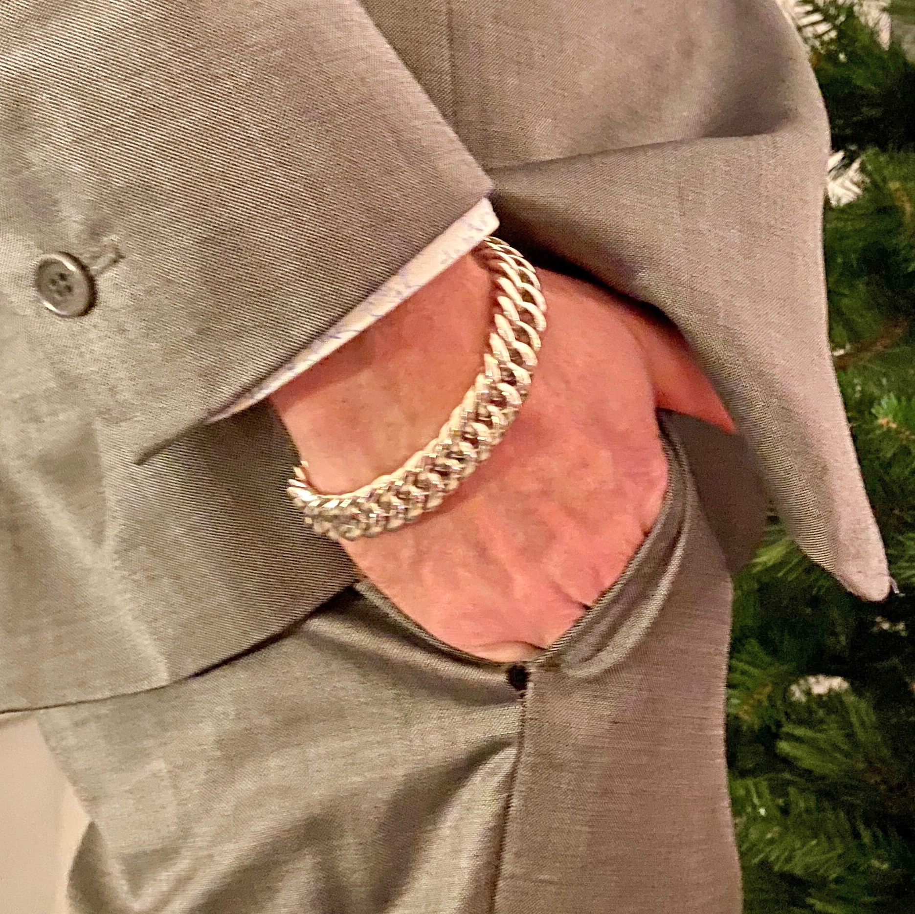 man wearing silver bracelet
